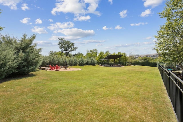 view of yard with a gazebo, a patio, and an outdoor fire pit