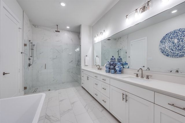 bathroom featuring walk in shower and vanity