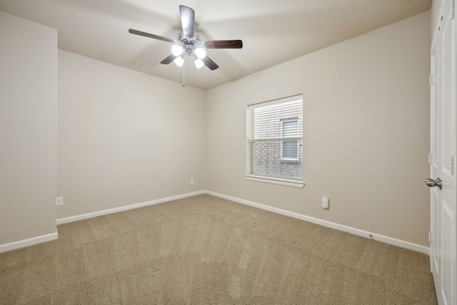 unfurnished room with ceiling fan and light carpet