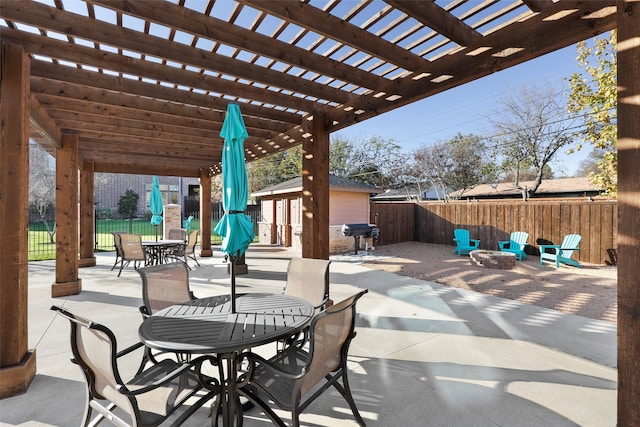 view of patio with an outdoor fire pit, a pergola, and area for grilling