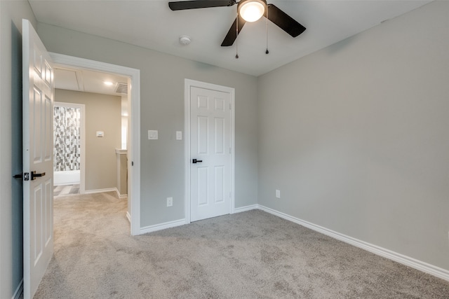 unfurnished bedroom featuring ceiling fan and light colored carpet