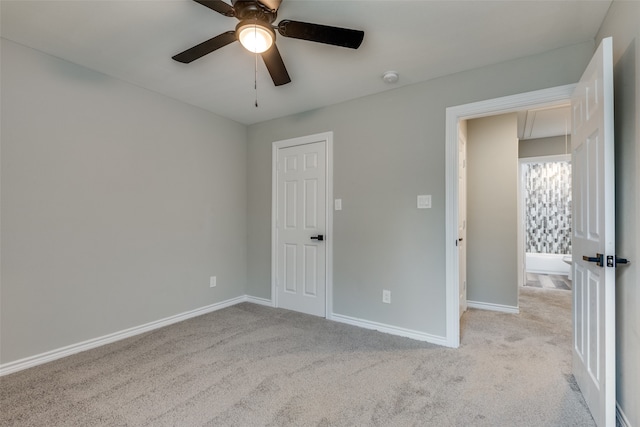 unfurnished bedroom with light colored carpet and ceiling fan