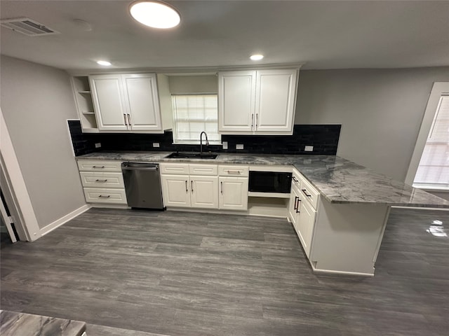 kitchen featuring white cabinetry, dishwasher, dark hardwood / wood-style flooring, kitchen peninsula, and sink