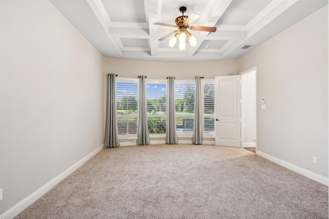 carpeted empty room featuring beam ceiling, ceiling fan, and coffered ceiling