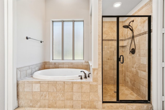 bathroom with separate shower and tub