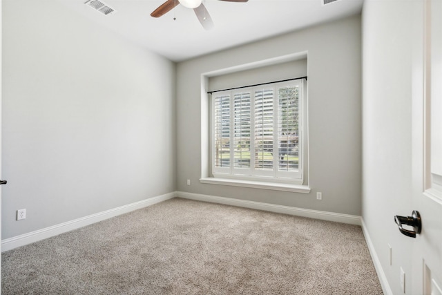 spare room featuring ceiling fan and carpet floors