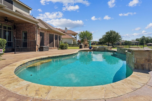 view of swimming pool with a patio area