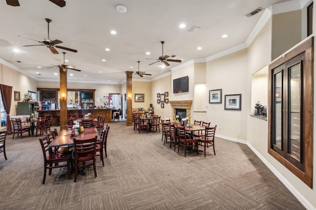 dining area with carpet and ornamental molding