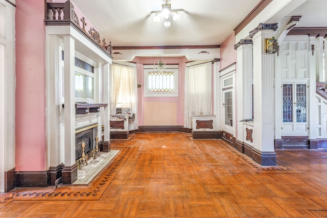 interior space with crown molding, a fireplace, an inviting chandelier, and parquet flooring