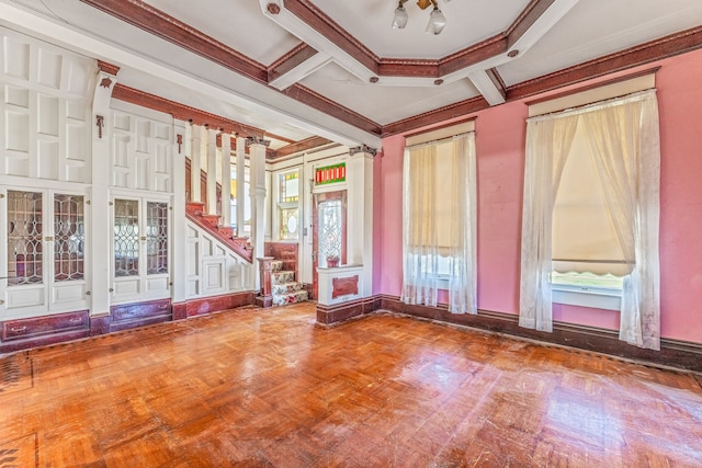 spare room with ornamental molding, beam ceiling, parquet flooring, and french doors