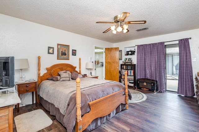 bedroom featuring ceiling fan, dark hardwood / wood-style flooring, a textured ceiling, and access to outside