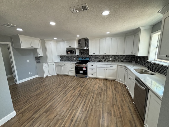 kitchen featuring dark hardwood / wood-style floors, sink, appliances with stainless steel finishes, and white cabinetry