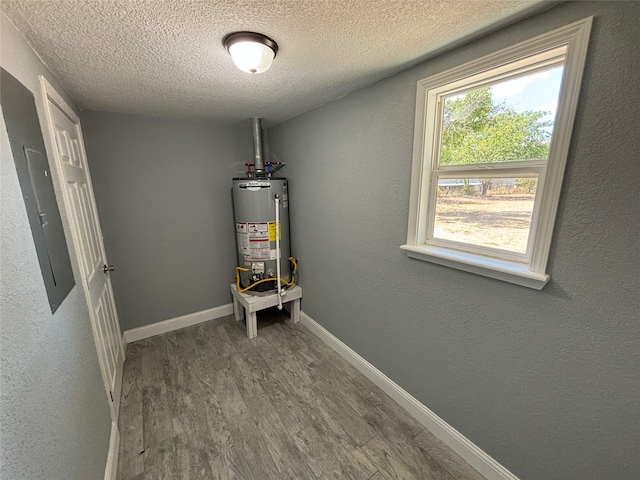 utilities featuring water heater and electric panel