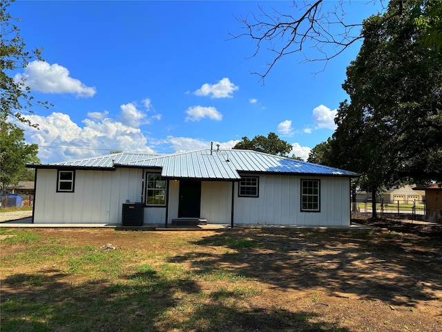 back of property with central air condition unit