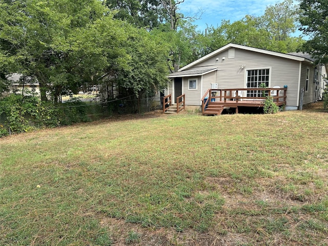 view of yard with a wooden deck