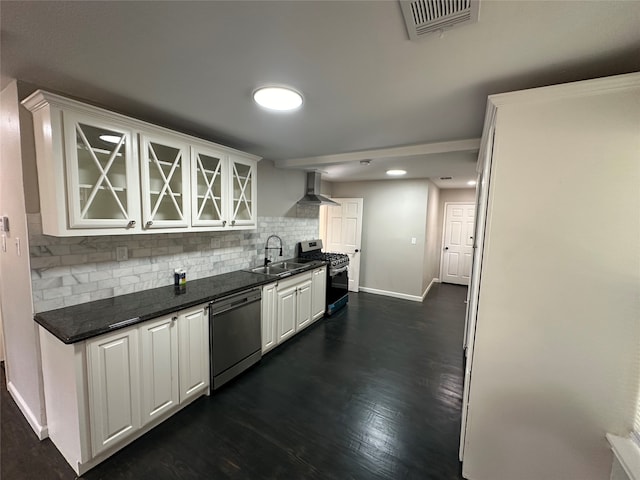 kitchen with sink, decorative backsplash, dark hardwood / wood-style floors, appliances with stainless steel finishes, and white cabinets