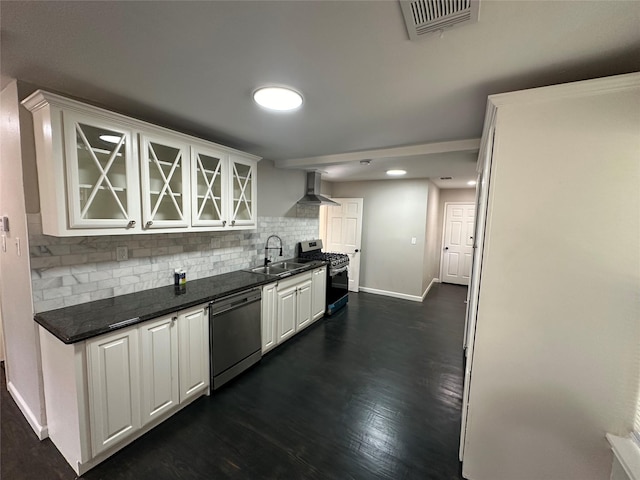 kitchen with a sink, white cabinets, appliances with stainless steel finishes, decorative backsplash, and glass insert cabinets