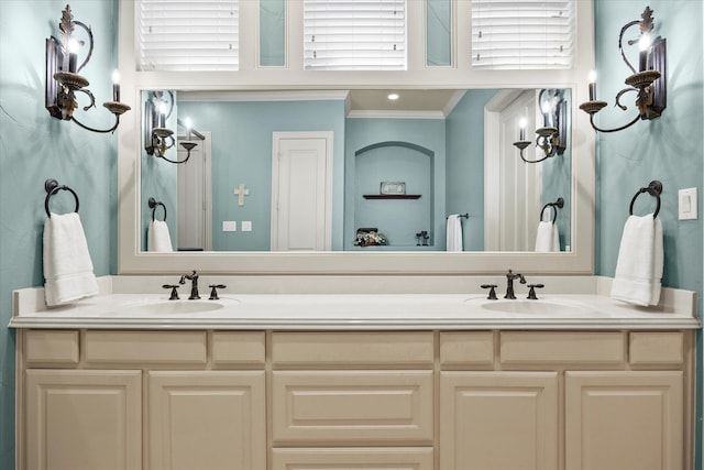 bathroom with plenty of natural light, vanity, and ornamental molding