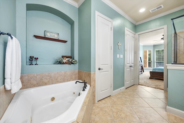 bathroom featuring tiled bath, tile patterned floors, ceiling fan, and crown molding