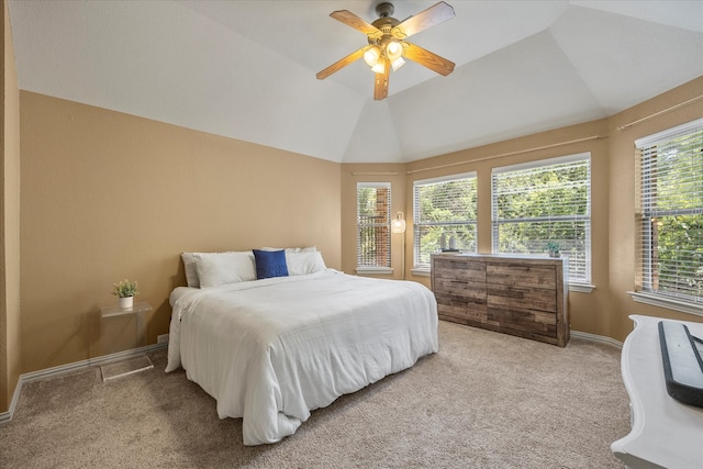 carpeted bedroom featuring multiple windows, ceiling fan, and lofted ceiling