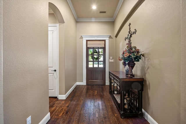 entryway with crown molding and dark wood-type flooring