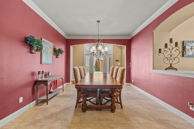 dining area featuring ornamental molding and a chandelier