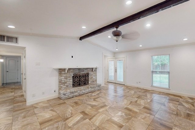 unfurnished living room featuring a fireplace, ceiling fan, and lofted ceiling with beams