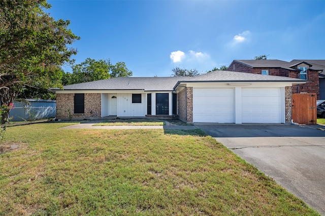 ranch-style house featuring a garage and a front lawn