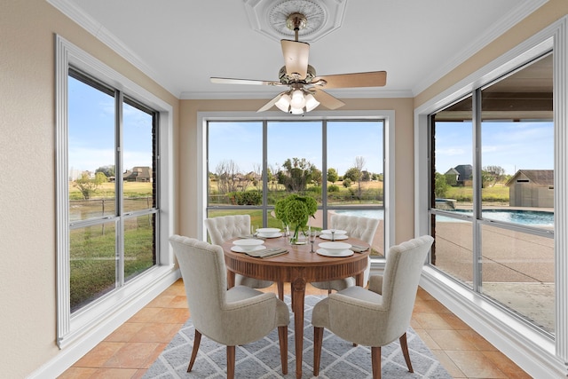 sunroom with plenty of natural light and ceiling fan