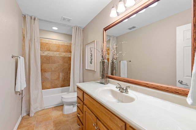 full bathroom featuring shower / bath combo, vanity, and toilet