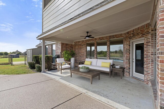 view of patio with ceiling fan and an outdoor living space