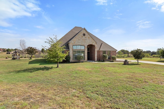 view of front of property with a front lawn