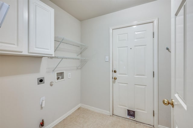 laundry room with baseboards, cabinet space, electric dryer hookup, washer hookup, and hookup for a gas dryer