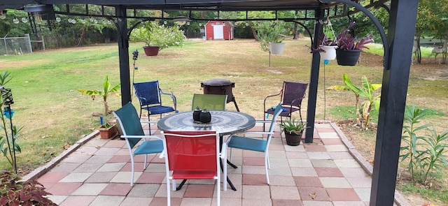 view of patio / terrace featuring a storage shed