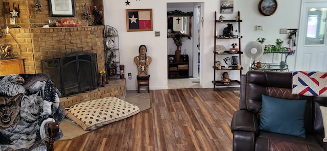 living room featuring a fireplace and light hardwood / wood-style flooring