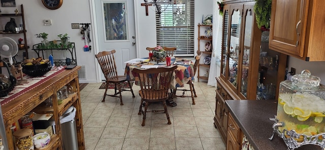 dining space with light tile patterned floors