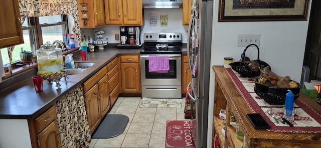 kitchen featuring stainless steel electric range oven, light tile patterned floors, and sink