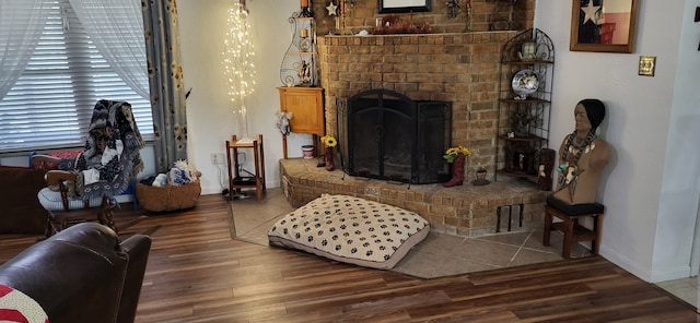 living room featuring a fireplace and hardwood / wood-style flooring