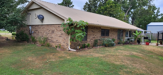 view of home's exterior with a yard