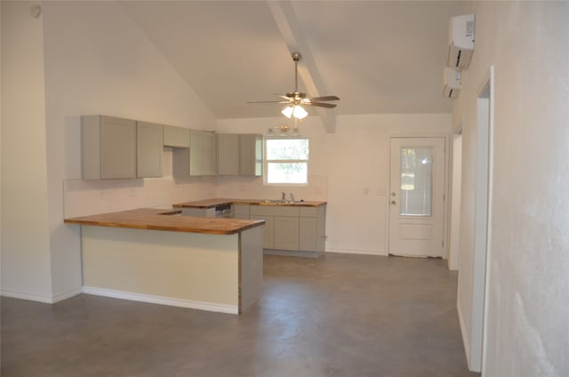 kitchen with a wall unit AC, ceiling fan, kitchen peninsula, high vaulted ceiling, and tasteful backsplash