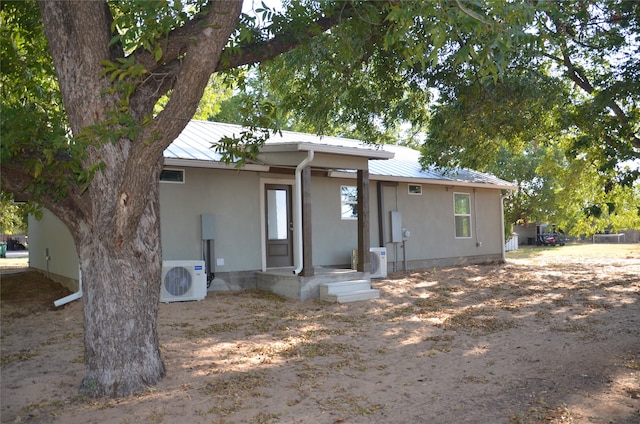 view of front of home with ac unit