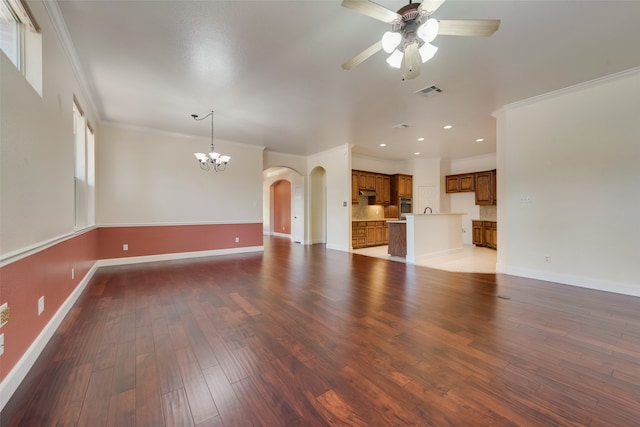 unfurnished living room with hardwood / wood-style floors, ceiling fan with notable chandelier, and crown molding