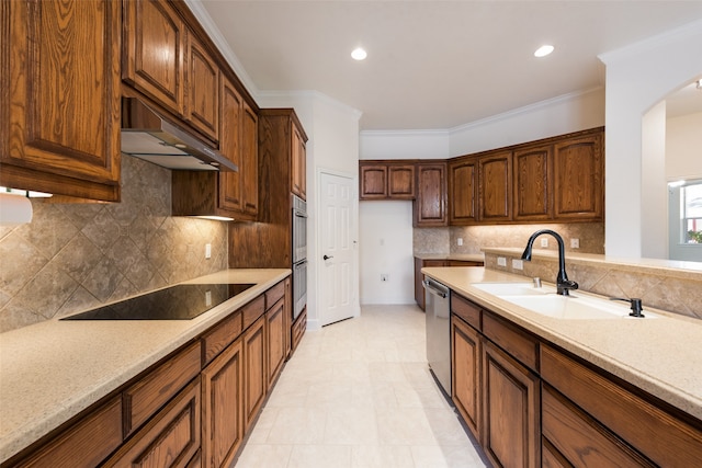 kitchen with crown molding, stainless steel appliances, sink, and decorative backsplash