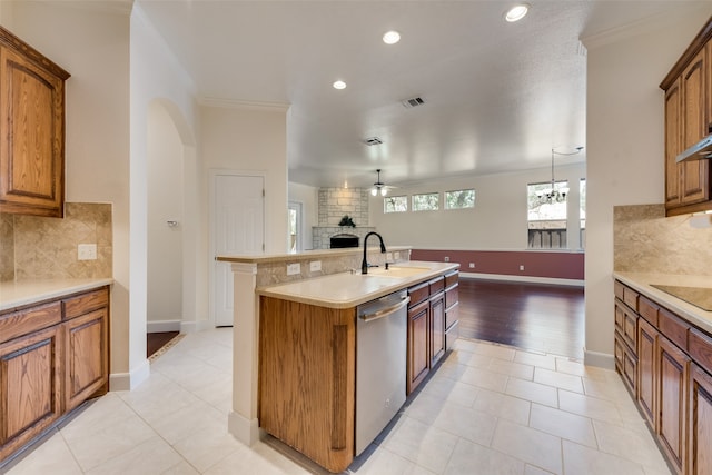 kitchen featuring ornamental molding, tasteful backsplash, sink, ceiling fan, and stainless steel dishwasher