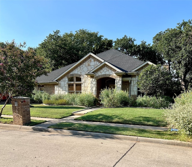 view of front of house with a front lawn