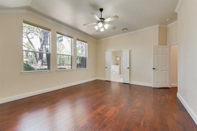 spare room with crown molding, vaulted ceiling, dark wood-type flooring, and ceiling fan