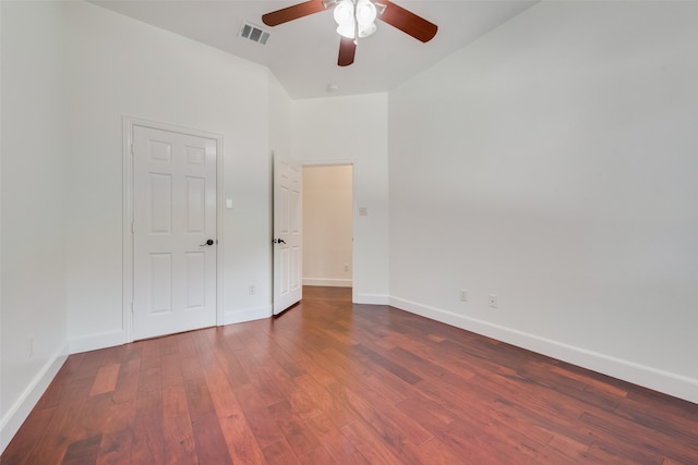 spare room featuring ceiling fan and dark hardwood / wood-style floors