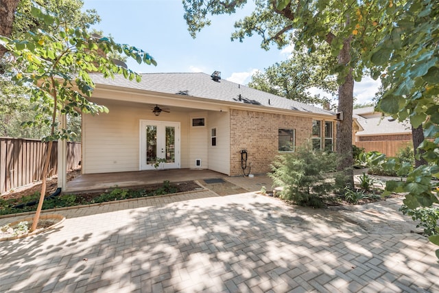 back of property featuring french doors, ceiling fan, and a patio