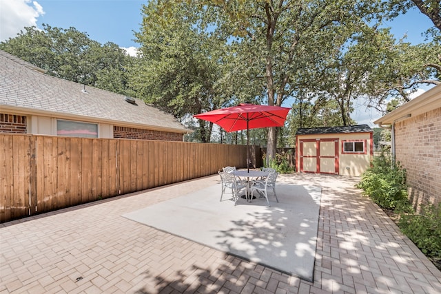 view of patio featuring a shed