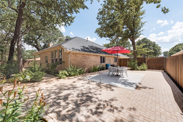 rear view of property with a patio area